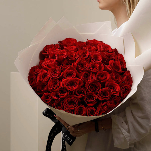 50 Red Milano Roses in Signature Vase Wrap